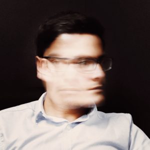 blurred image of a man shaking his head