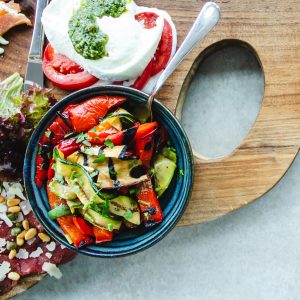 cutting board with various vegetables on top