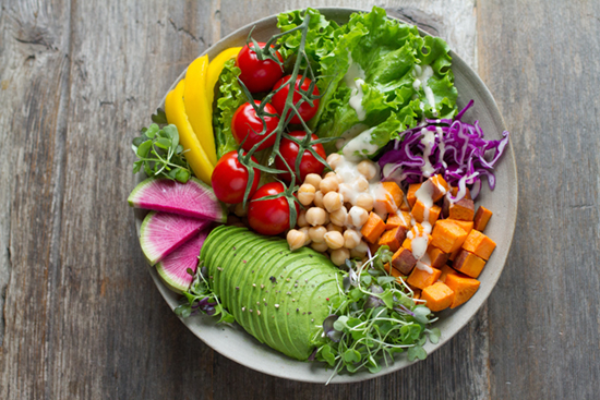 bowl full of healthy veggies and salad