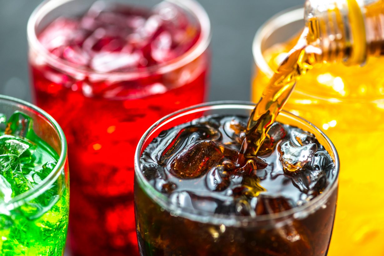 close up of brightly colored soft drink in glasses