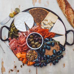 assorted meats and cheeses on serving tray