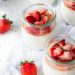 bowls of yogurts with strawberries on top
