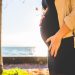 pregnant woman's profile with ocean on the horizon