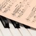 sheet music on top of piano keys