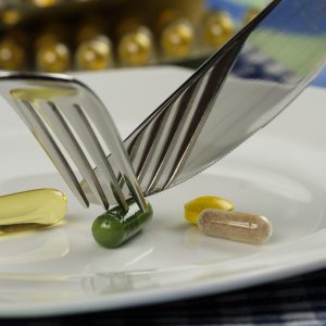 cutting vitamins with a fork and knife