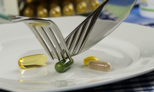 cutting vitamins with a fork and knife