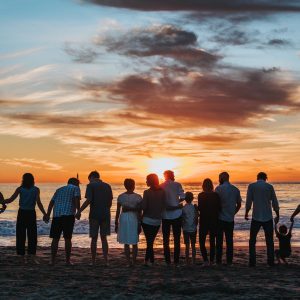 silhouette of a family against the sunset