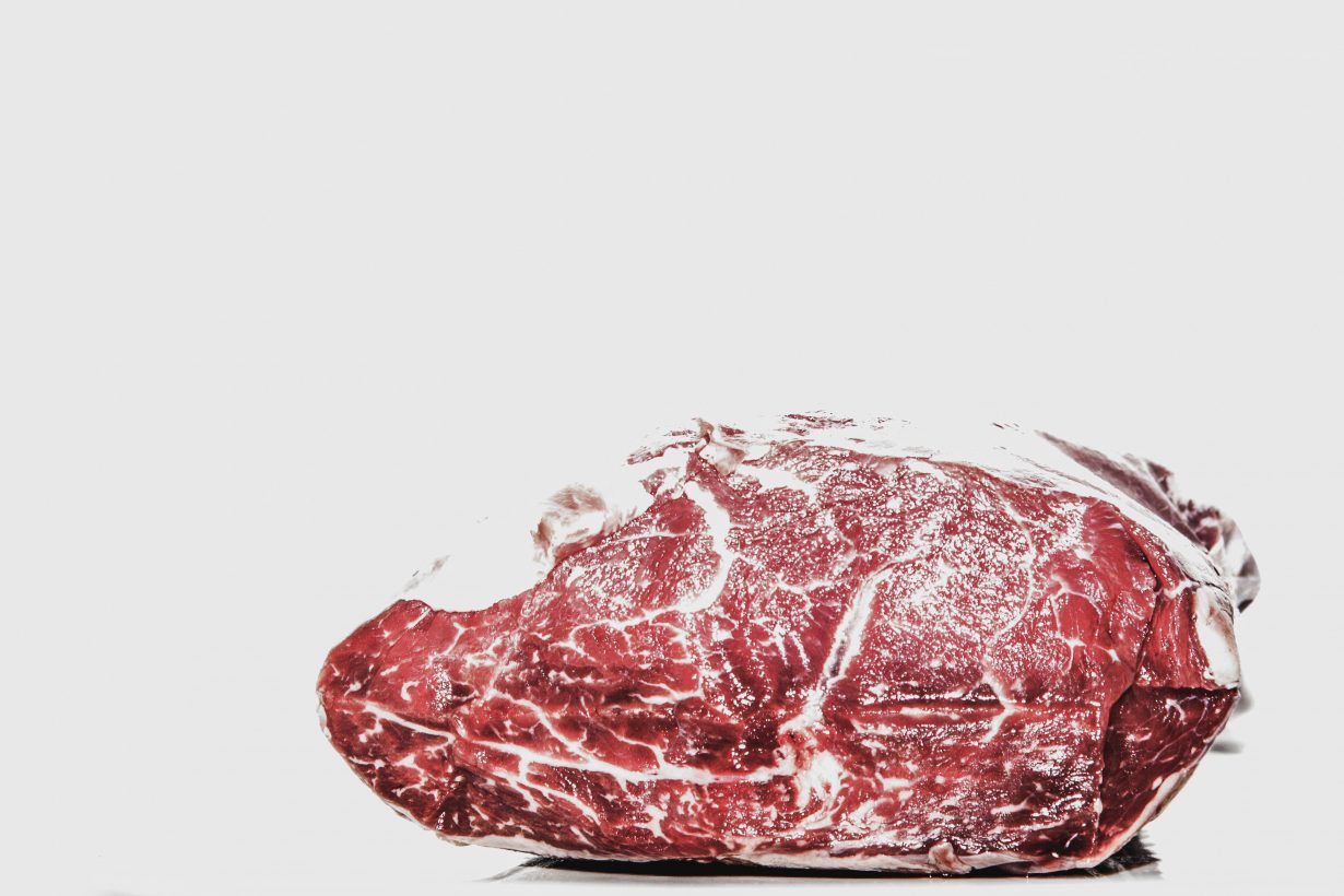 close up of a cut of raw steak