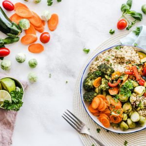 vegetable salad on a white background with vegetables around