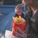woman eating McDonald's french fries