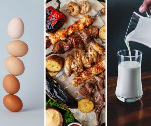close up of eggs, grilled meats, and a glass of milk