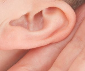 ear with hand cupped around it