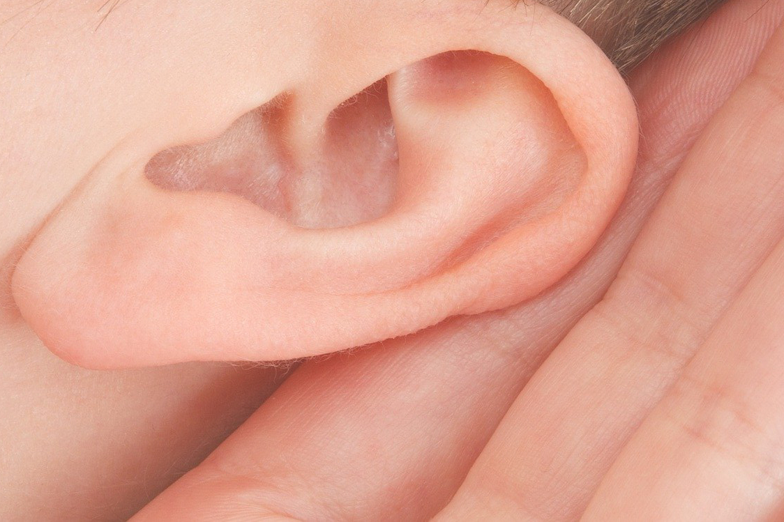 ear with hand cupped around it