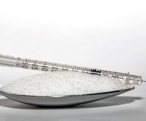 spoonful of sugar with an insulin syringe on top