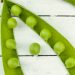 peas in a pod on a white surface