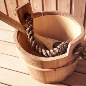 wooden spoon inside a wooden bucket