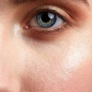 close up of a woman's nose cheek and eye