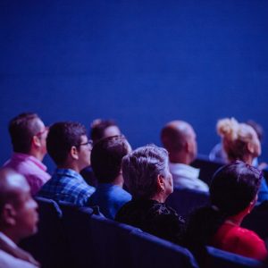 people watching a movie in a theater