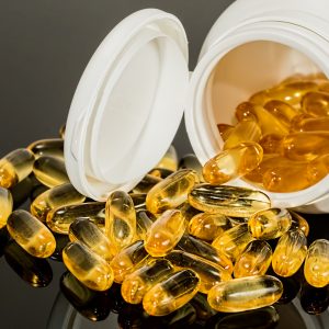 bottle of vitamin d tipped over with pills all around Diabetes