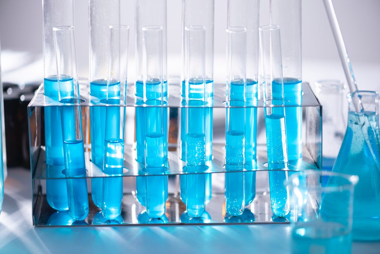 clear test tubes filled with blue liquid