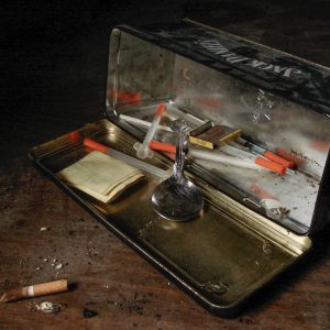 tin full of drug paraphernalia