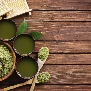 matcha tea in cups with matcha powder