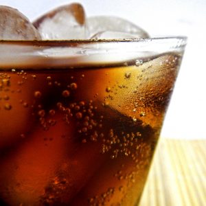 close up of dark soda in a drinking glass