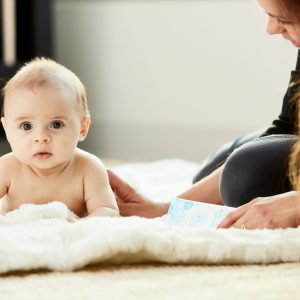 mother and baby sitting on the floor together