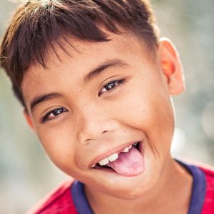 child sticking out their tongue