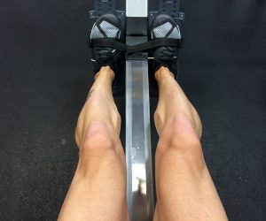 man's legs working out on a machine