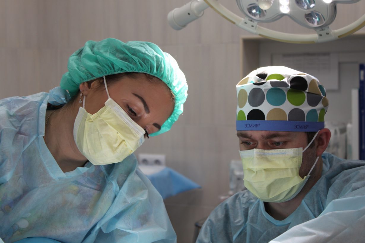 two surgeons performing surgery