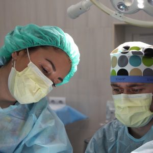 two surgeons performing surgery