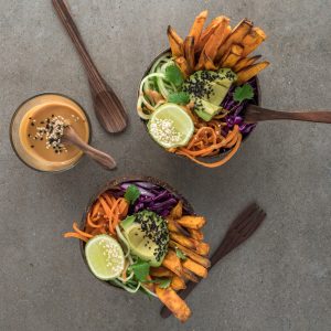 brown bowls full of vegetable salad