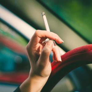 woman's hand holding a cigarette