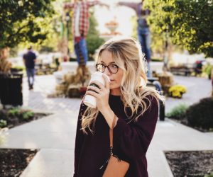Woman drinking starbucks coffee outside