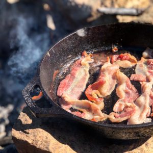 bacon frying in a pan
