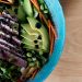 close up of a healthy salad in a blue bowl