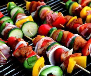 vegetables on skewers on a grill
