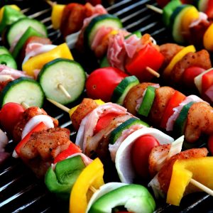 vegetables on skewers on a grill