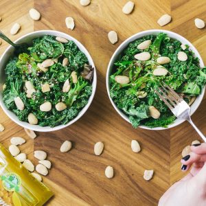 two green salads with nuts