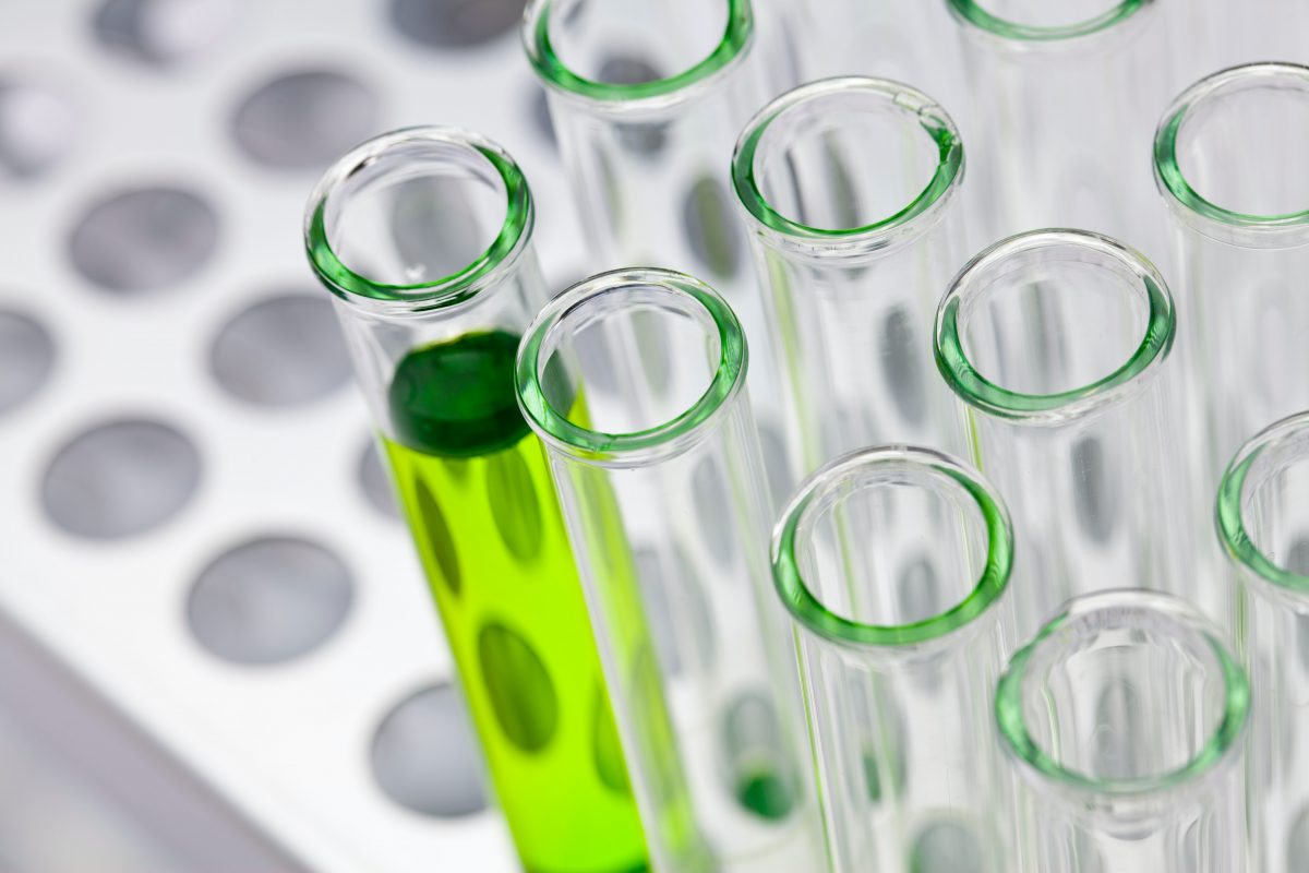 glass vials and bright green liquid