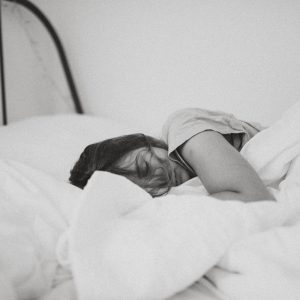woman sleeping on her bed