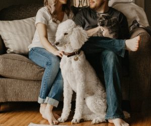 man and woman with their pets