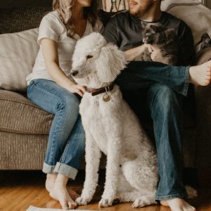 man and woman with their pets