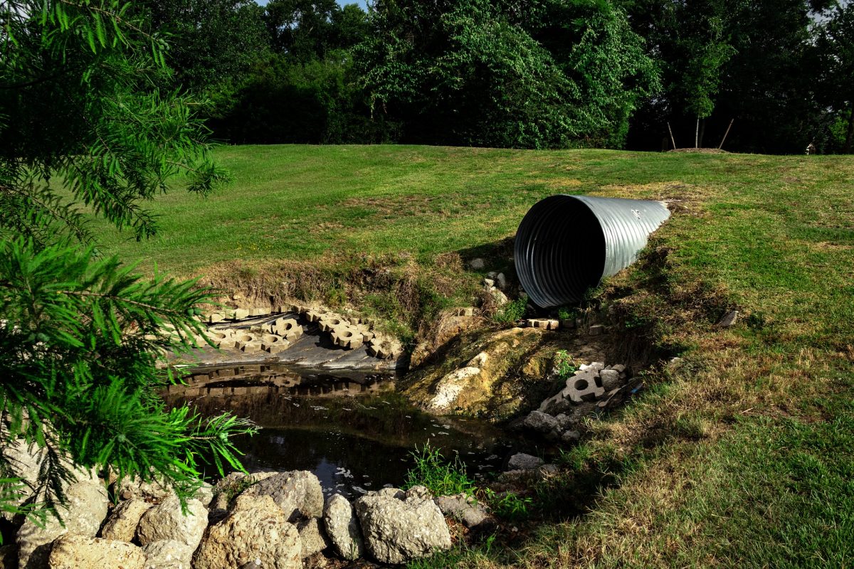 sewage pipes in grass