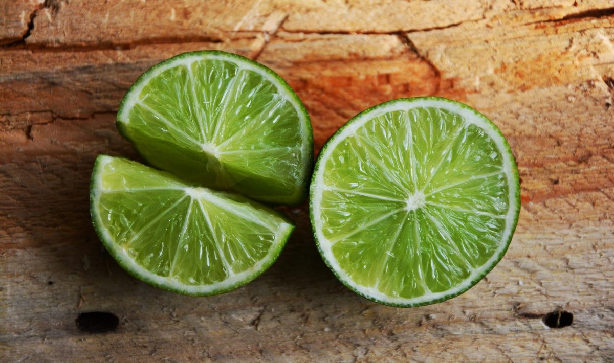 limes on a wood surface