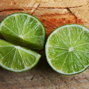 limes on a wood surface