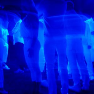 people standing in a blue light