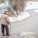 old man walking in the winter