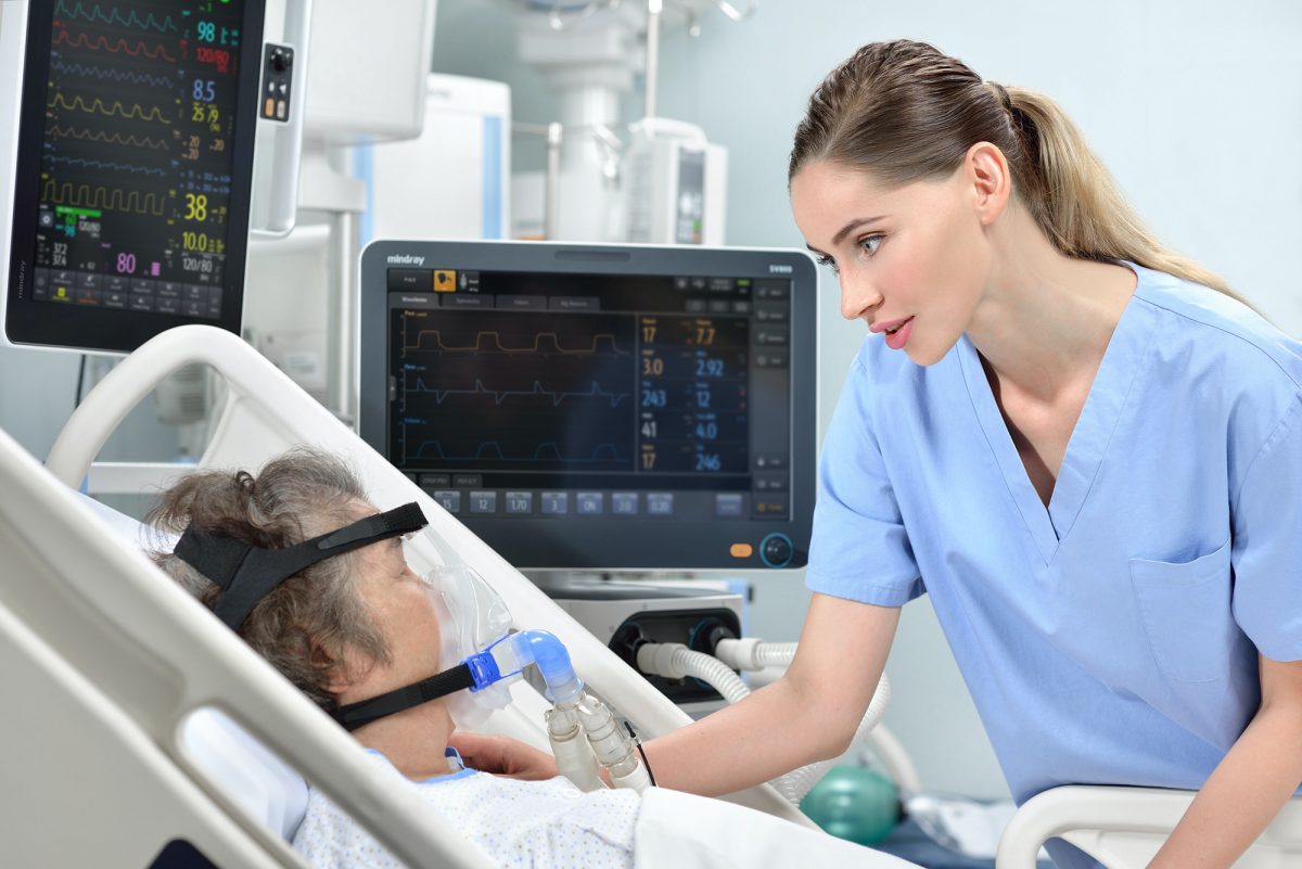 nurse and woman on ventilator